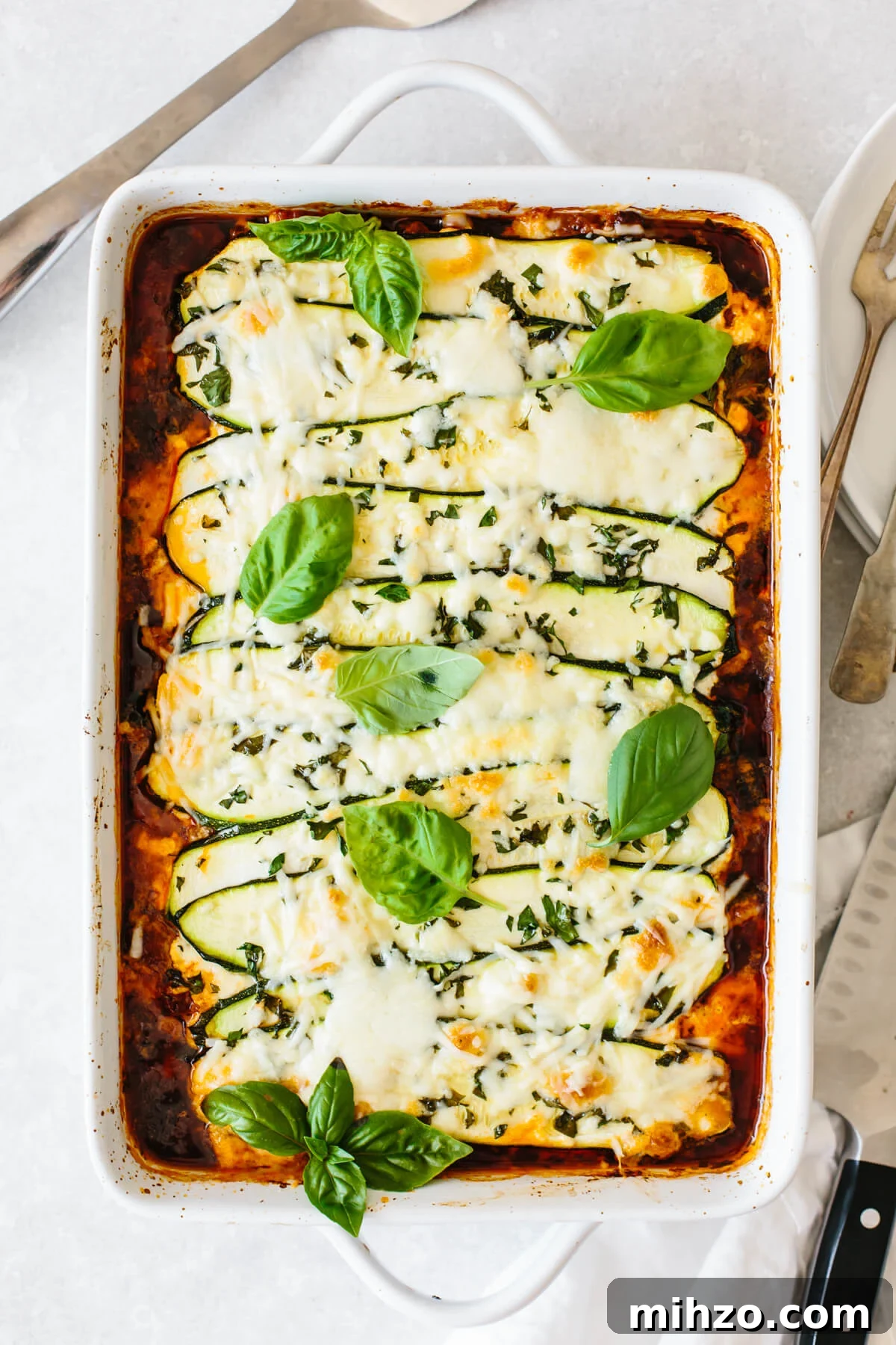 Zucchini lasagna with basil leaves