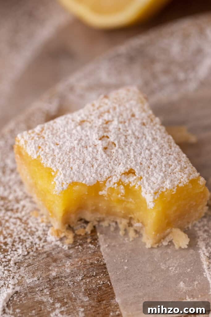 Small-Batch Lemon Bars Recipe: Perfect Citrus Dessert for Two 2 Small Batch Lemon Bars recipe with a bite taken out