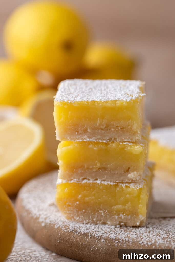 Small-Batch Lemon Bars Recipe: Perfect Citrus Dessert for Two 4 small batch lemon bars recipe stacked on top