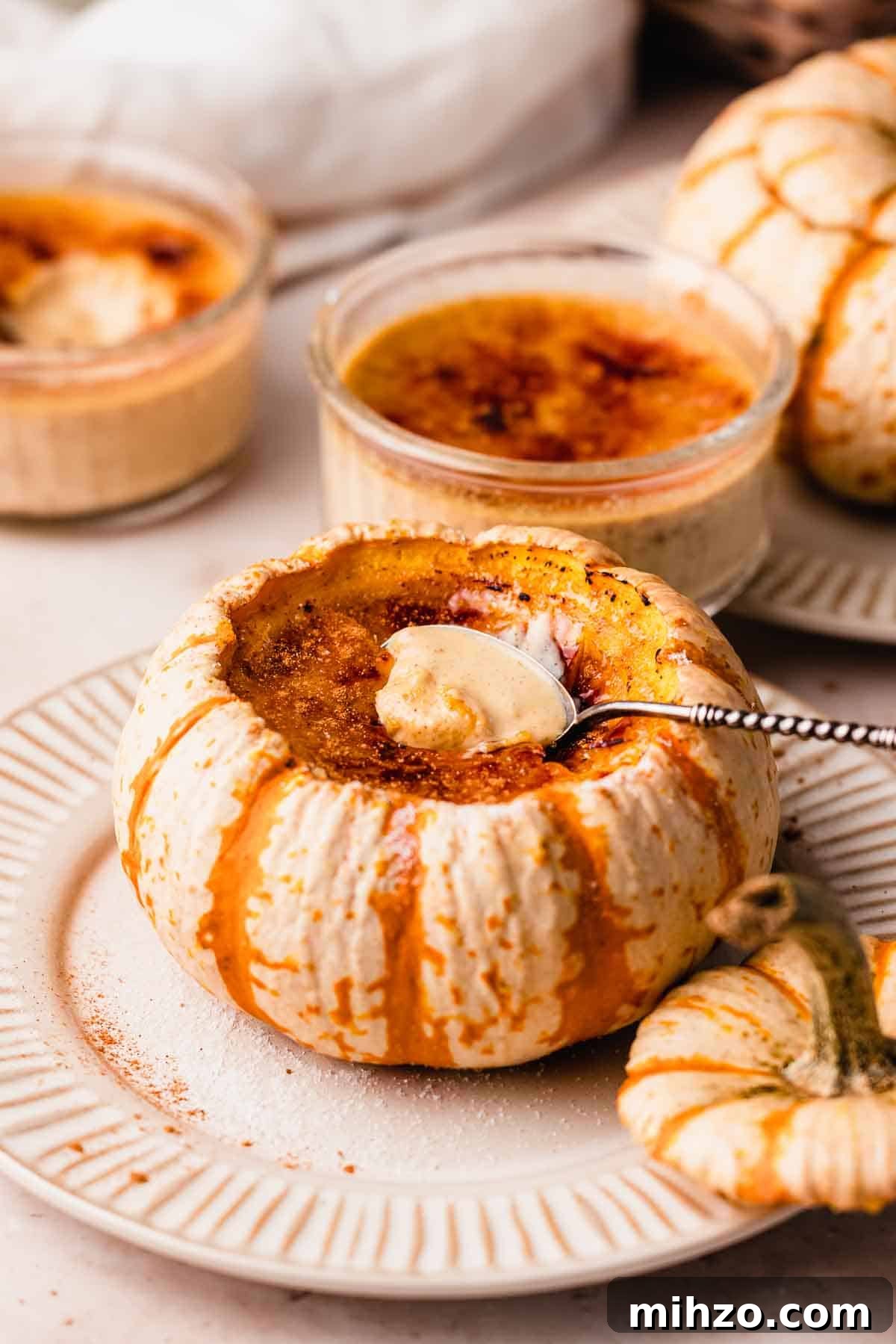 Pumpkin Crème Brûlée Recipe — Silky Fall Dessert Tutorial 11 creme brulee inside of a pumpkin with spoon
