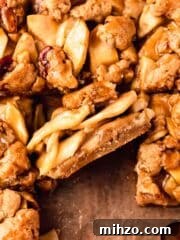 apple pie bar on its side with layers of sliced apples