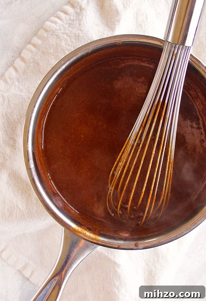 This gluten free red enchilada sauce is so easy to make - it only takes a few minutes and makes use of pantry staple ingredients. It's the perfect sauce for any enchilada recipe. Great for Cinco de Mayo or when you have a craving for good Mexican food! (Vegetarian/Vegan) | robustrecipes.com