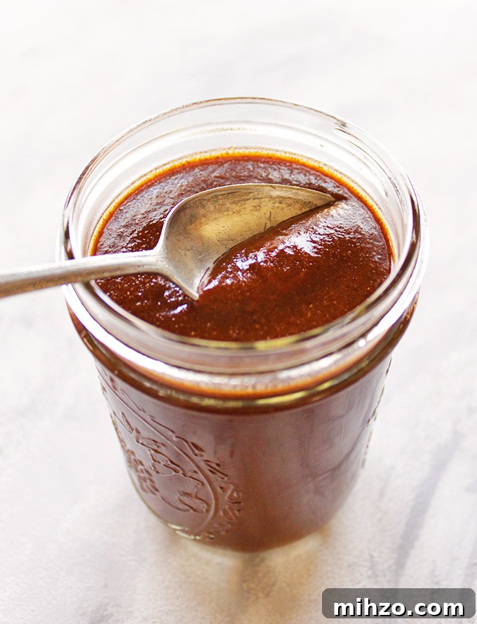 This gluten free red enchilada sauce is so easy to make - it only takes a few minutes and makes use of pantry staple ingredients. It's the perfect sauce for any enchilada recipe. Great for Cinco de Mayo or when you have a craving for good Mexican food! (Vegetarian/Vegan) | robustrecipes.com
