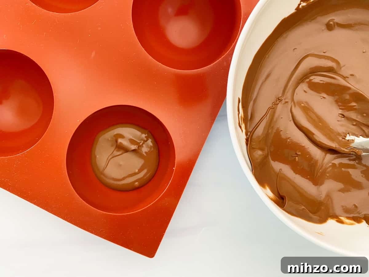DIY Hot Cocoa Bombs with Free Printable Gift Tags 5 melted chocolate and hot chocolate mold