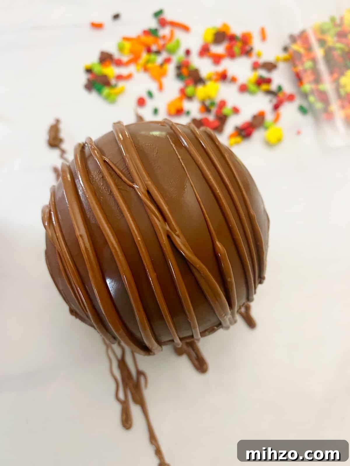 DIY Hot Cocoa Bombs with Free Printable Gift Tags 10 hot chocolate bomb with melted chocolate piped on tops