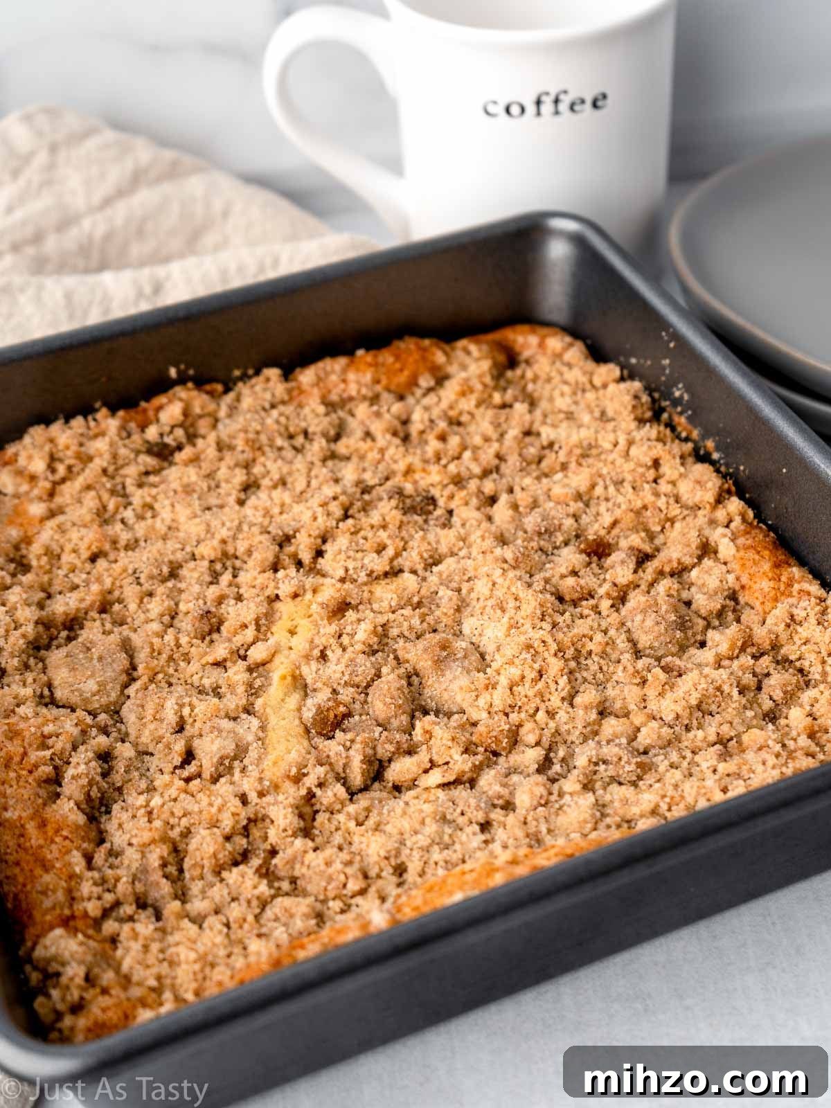 Eggless Coffee Cake with Cinnamon Streusel Topping 3 Cinnamon streusel coffee cake in a square baking pan.