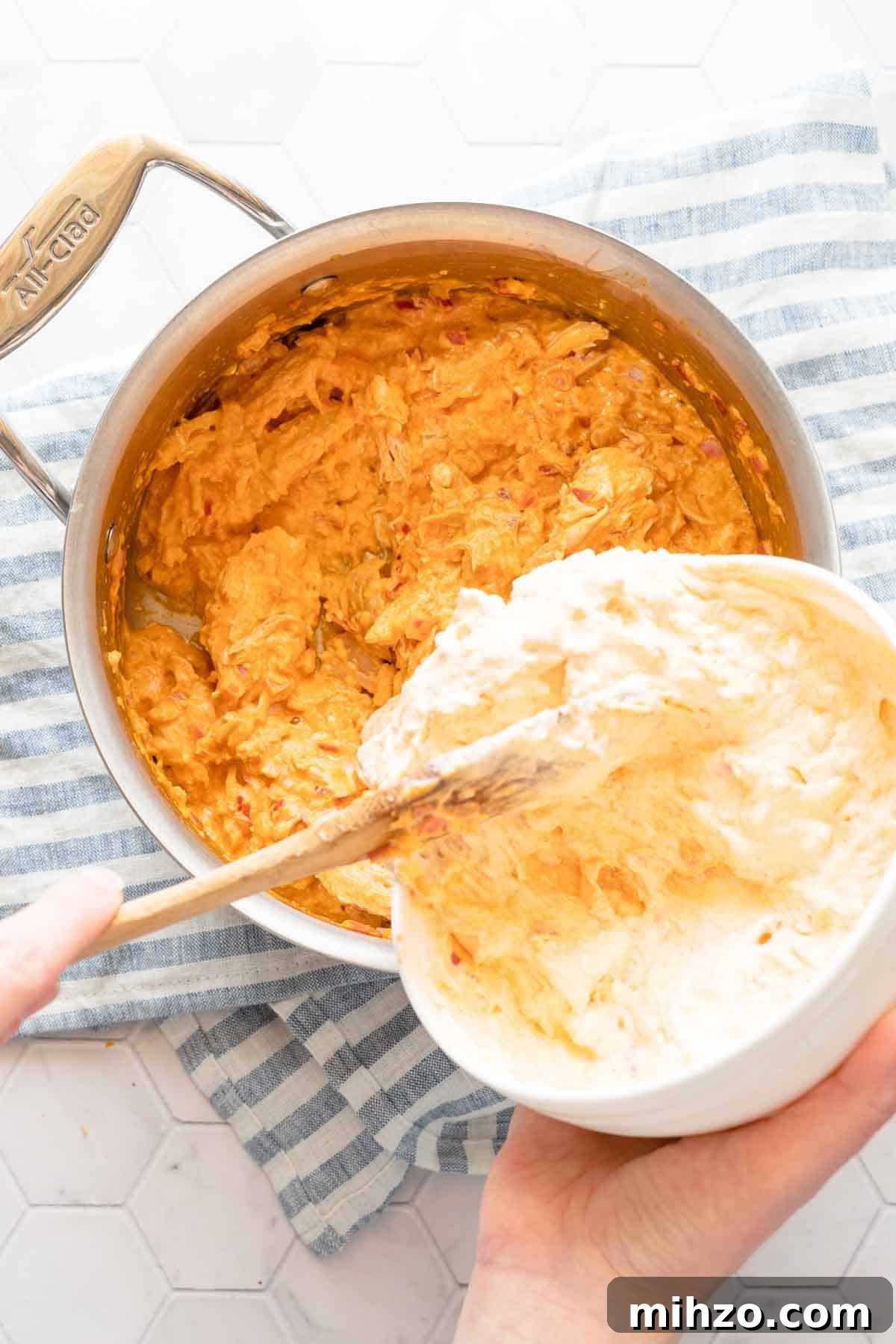 adding tempered yogurt to dip.