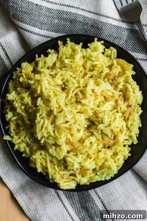 Instant Pot Rice-A-Roni: Quick One-Pot Copycat Recipe 4 a serving of chicken Rice-a-Roni that was cooked in the Instant Pot, plated on a black plate
