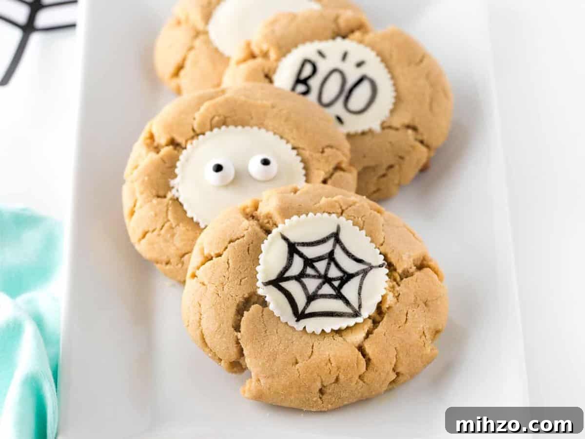 DIY Halloween Cookies: Draw Your Own Spooky Designs 11 Tray of decorated Halloween cookies