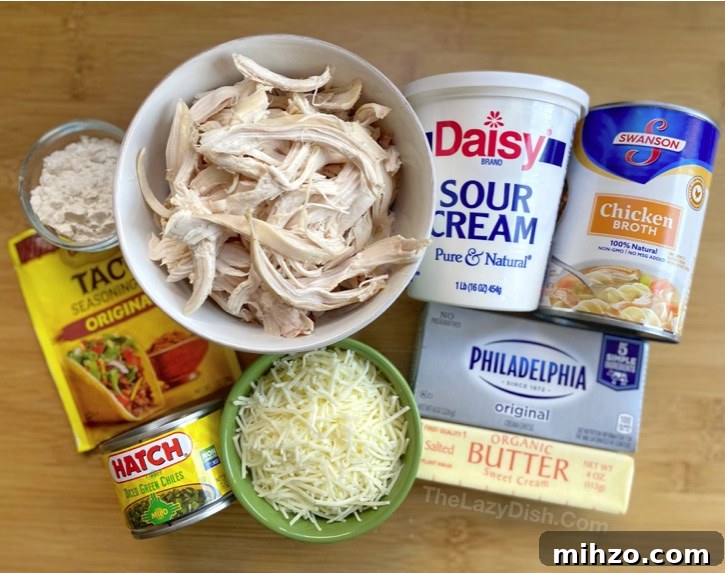 Creamy White Chicken Enchiladas Recipe 3 Homemade White Chicken Enchiladas -- The BEST quick and easy family dinner recipe made with rotisserie chicken, cream cheese and sour cream. So yummy!