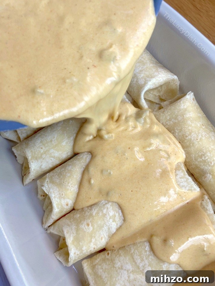 Creamy White Chicken Enchiladas Recipe 4 Creamy White Chicken Enchiladas Recipe -- So quick and easy to make for busy weeknight dinners with your family! Fast to throw together after work, and made with cheap ingredients including rotisserie chicken, sour cream and cream cheese.
