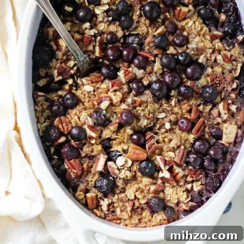 Baked Oatmeal with Blueberries and Apples 2 Wholesome and filling, this baked blueberry and apple oatmeal is a family favorite!