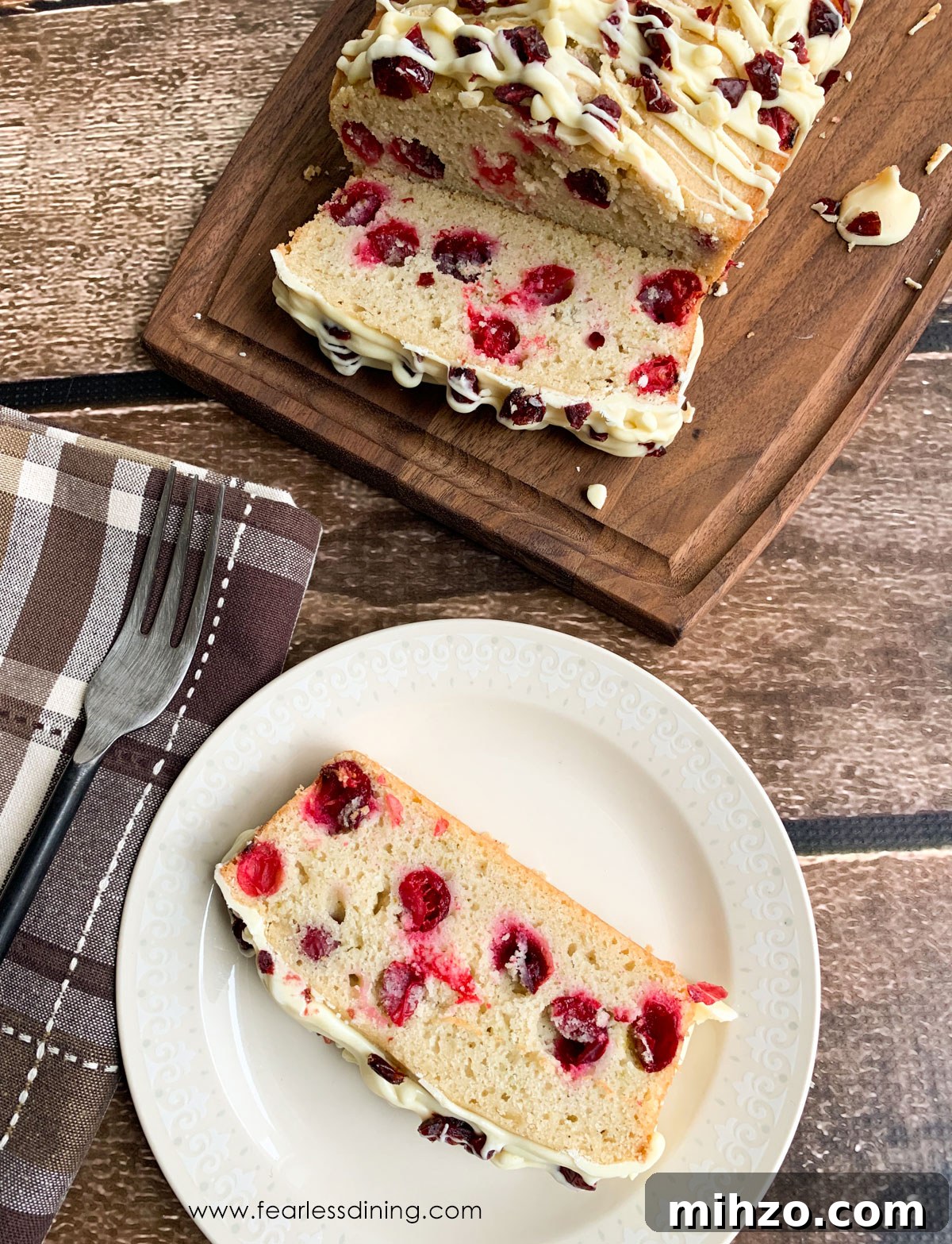 Gluten-Free Cranberry Pound Cake with Dairy-Free Option 9 A slice of gluten free cranberry cake on a plate.