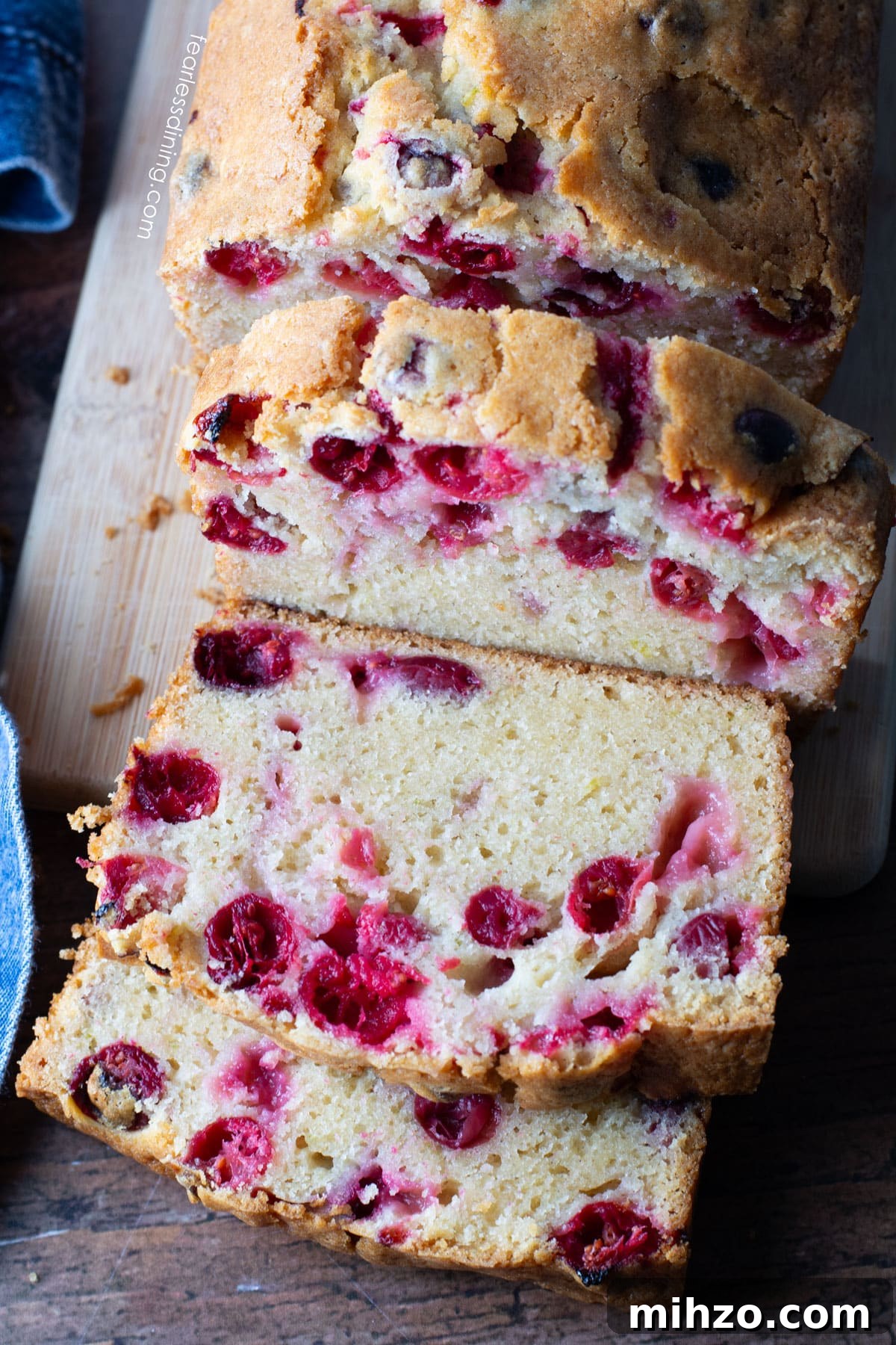 Gluten-Free Cranberry Pound Cake with Dairy-Free Option 10 The top view of a sliced loaf of cranberry cake.