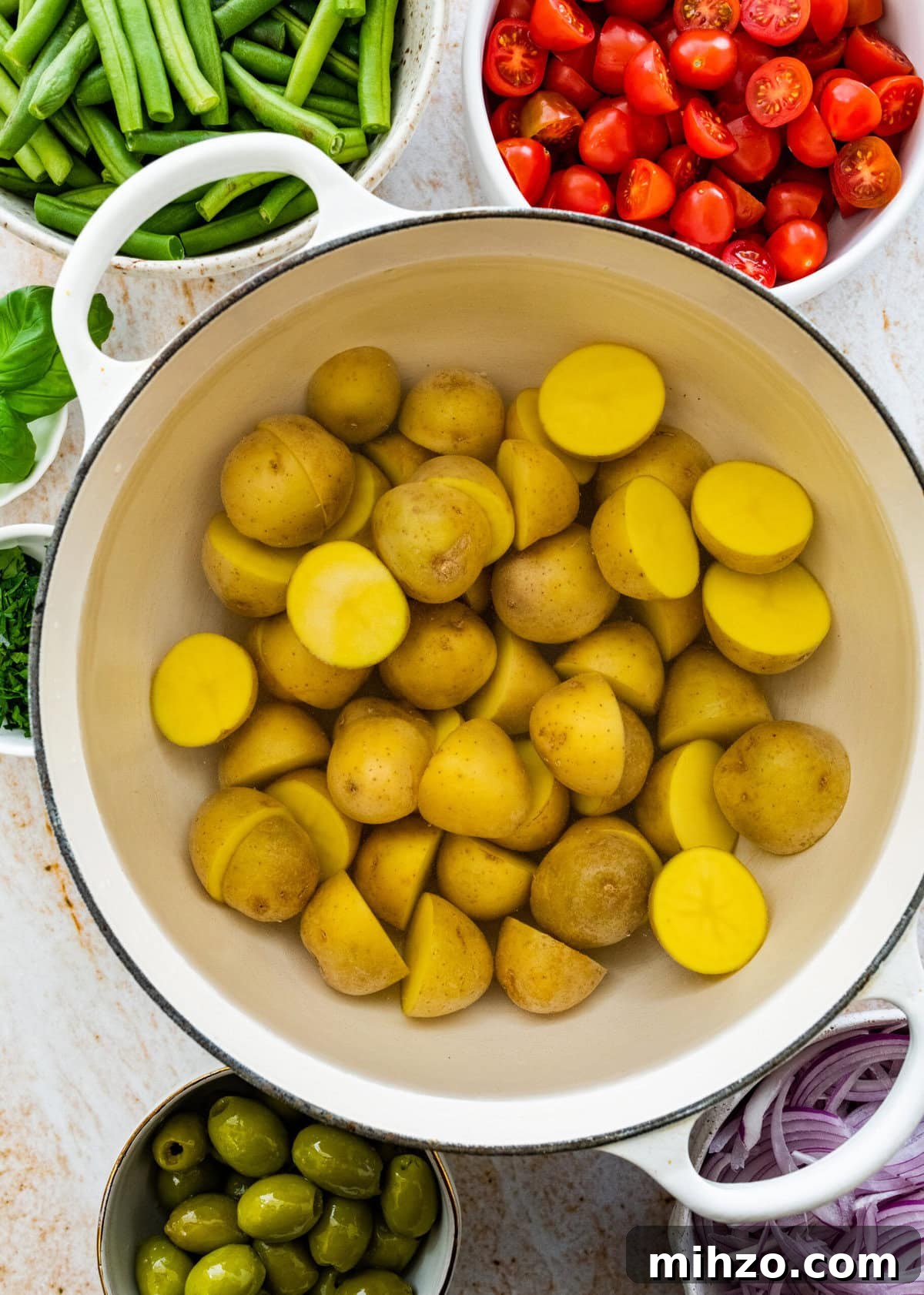 Italian Potato and Green Bean Salad Recipe 5 How to make Italian potato salad: potatoes in a pot.