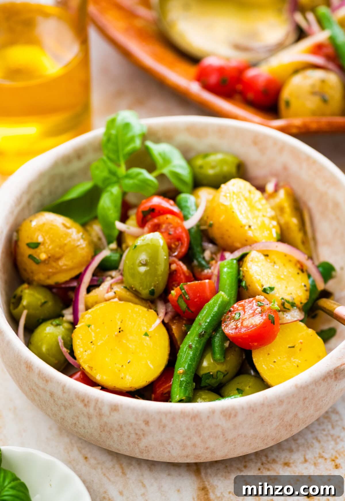 Italian Potato and Green Bean Salad Recipe 10 Italian potato salad in a white bowl ready to eat.