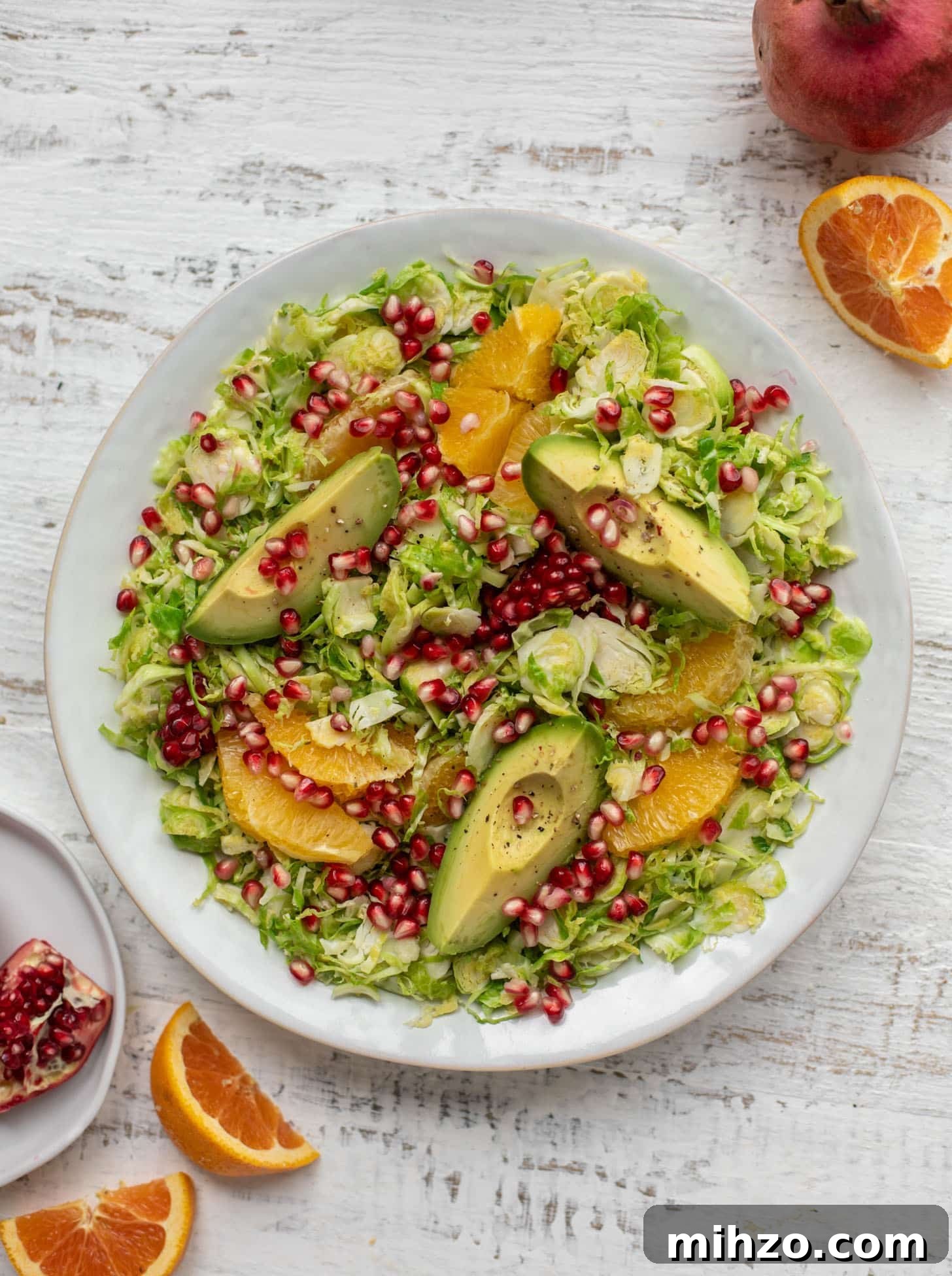 Citrus Brussels Sprouts Salad with Avocado & Pomegranate 5 shredded citrus brussels sprouts salad with avocado and pomegranate