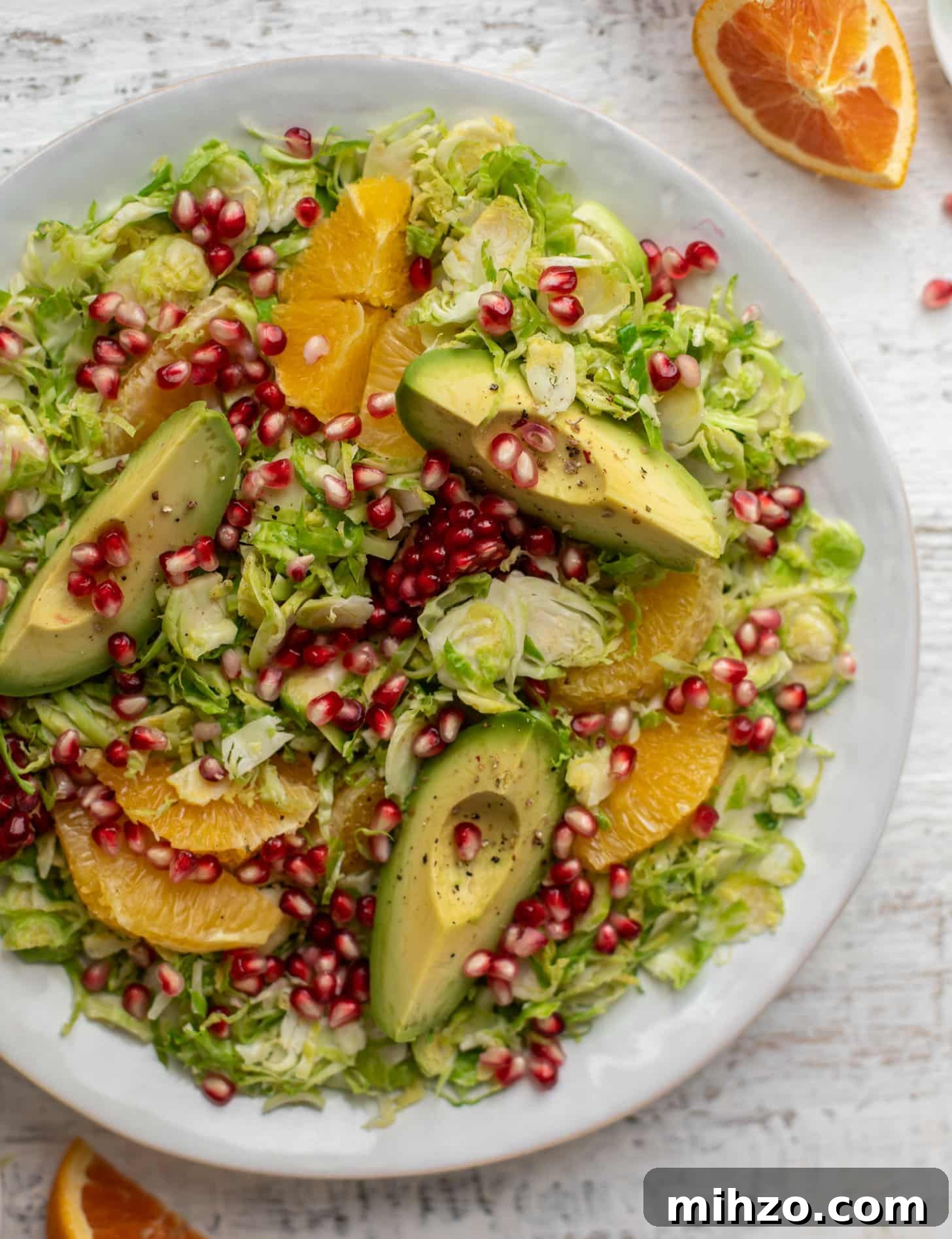 Citrus Brussels Sprouts Salad with Avocado & Pomegranate 6 shredded citrus brussels sprouts salad with avocado and pomegranate