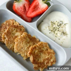 Cinnamon apple fritters served with strawberries and yogurt.