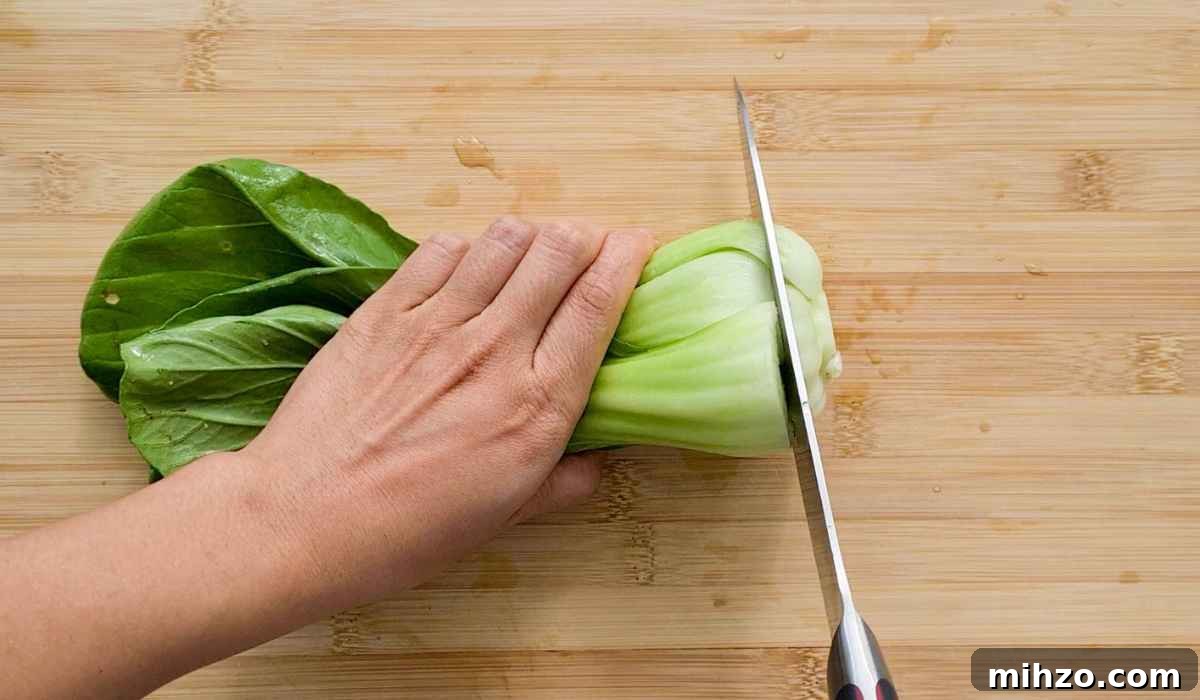 Ginger and Garlic Bok Choy Soup Recipe 6 A head of bok choy being cut