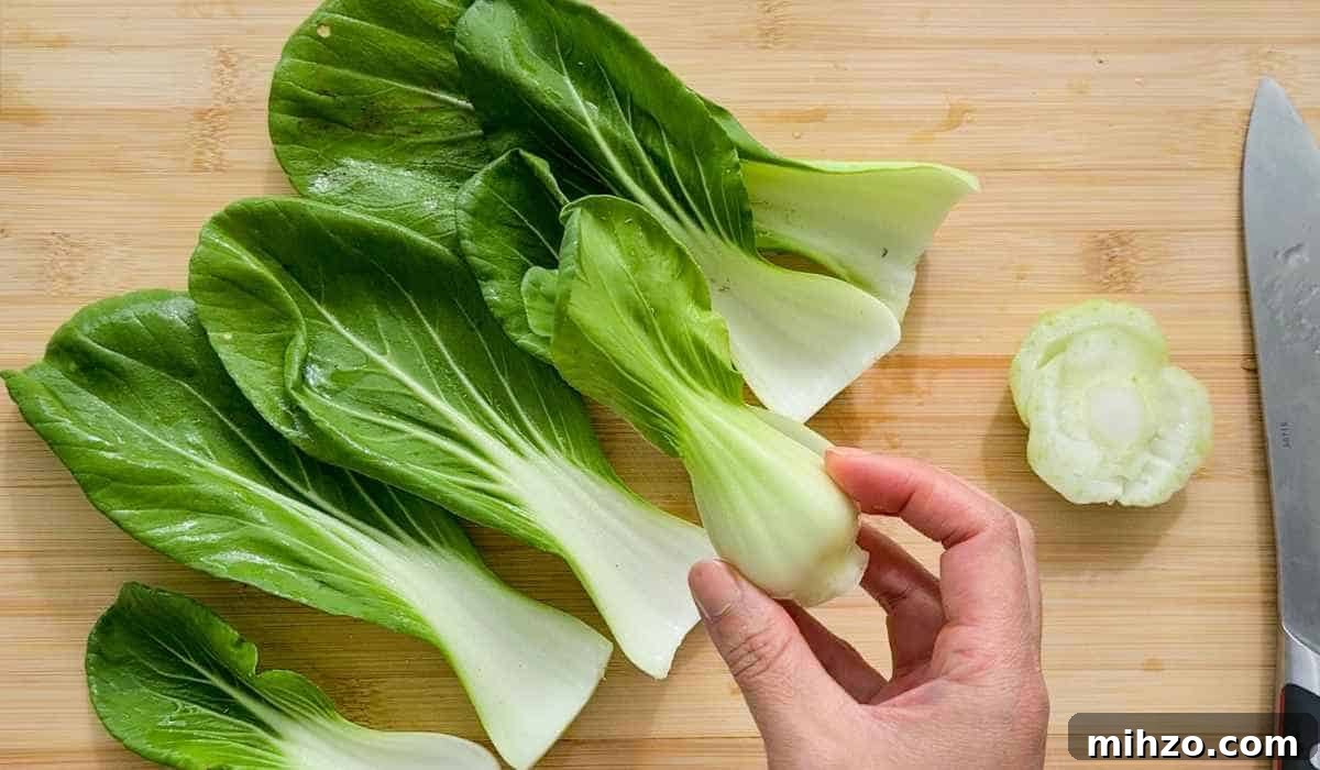 Ginger and Garlic Bok Choy Soup Recipe 7 Bok choy leaves separated and the core being held by a hand