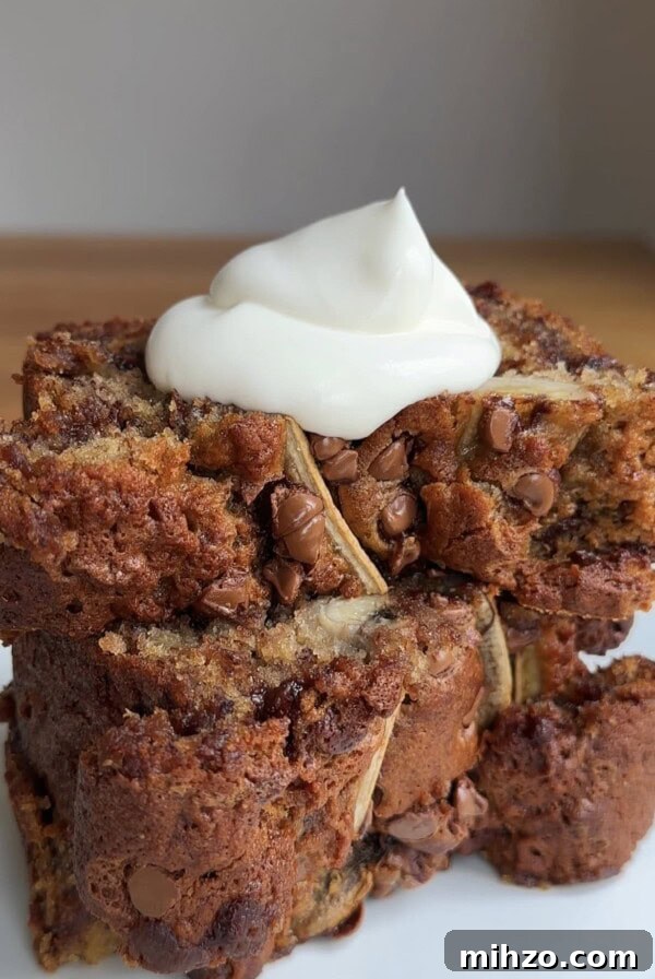 a spoon of yoghurt on slices of chocolate chip banana bread